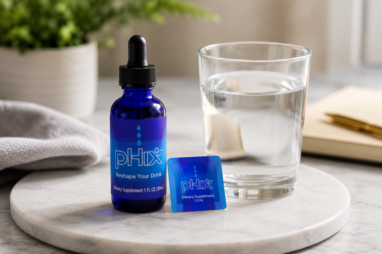 pHix bottle and snap beside a glass of water
